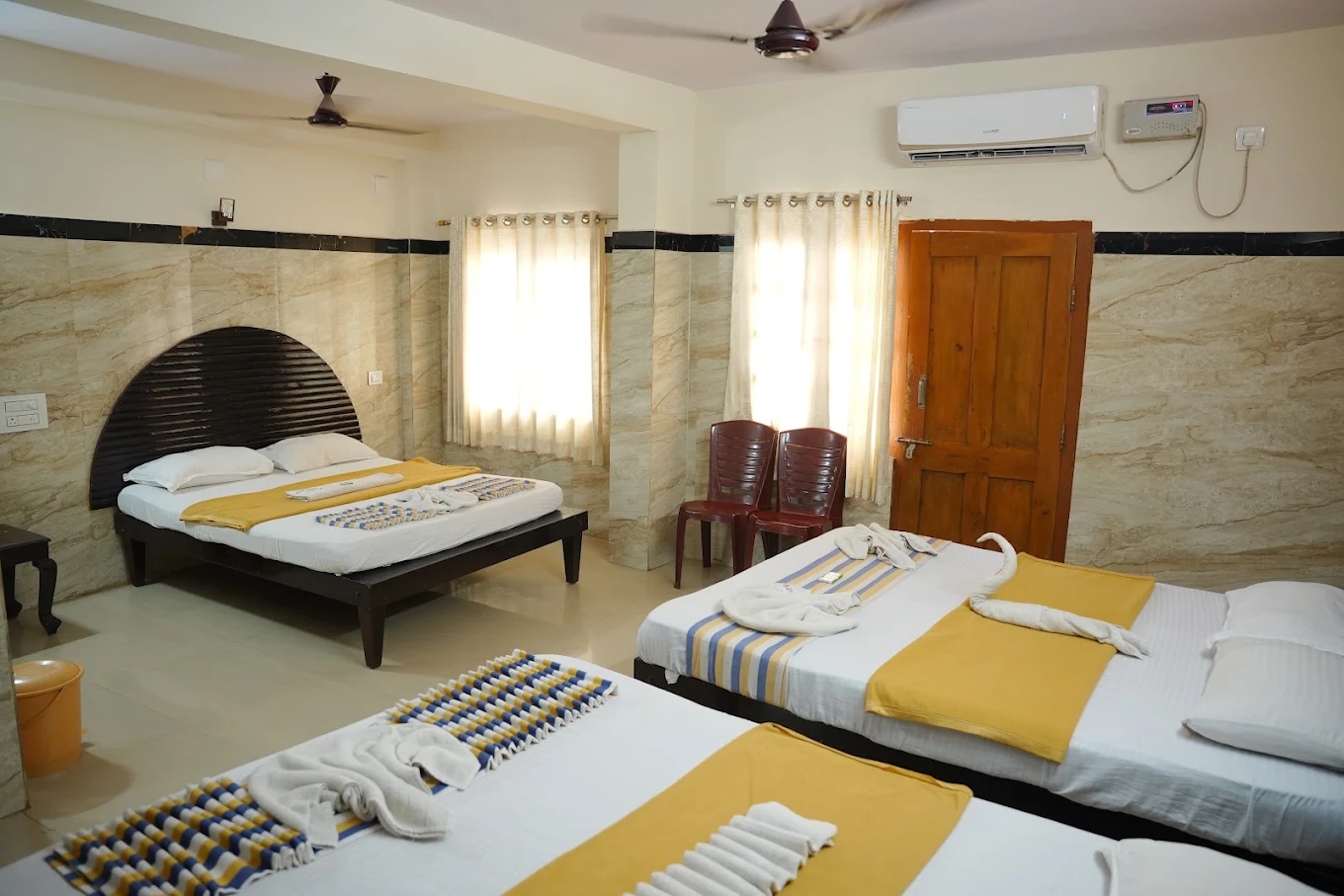 Air conditioned room with multiple beds